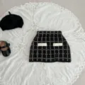 Detailed shot of infant black and white knit skirt set with elegant tweed style pattern. - 66cm / Bottoms