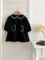 Abito nero a maniche lunghe per neonata con colletto e tasche ricamati in bianco, delizioso. - Motivo Vestito Nero