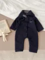 Detailed view of dark blue quilted baby winter romper featuring warm fleece lining and cozy design. - 100cm / Dark Blue