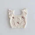 Close-up details of baby knit vest with cute ruffles, delicate embroidery and soft fabric. - 66cm / Camisoles