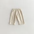 Detailaufnahme von Kinder Freizeithose, weicher Baumwollstoff und bequemer Gummizugbund. - Aprikose / 73cm