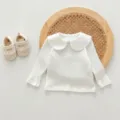 White baby long sleeve t-shirt detail showing cute doll collar and soft ribbed cotton fabric. - 66cm / Tops / White