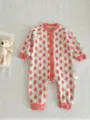 Detailed shot of baby floral knit romper, cozy long sleeve jumpsuit with cute buttons for infants. - Pink Floral