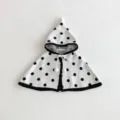 Details of the baby knitted polka dot hooded cape showing cute pom-pom and soft texture. - 80cm / White