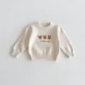 Close-up detail of infant knit sweater with cute animal embroidery and soft texture. - 66cm / Beige Apricot