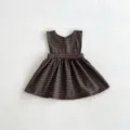Detailed view of the brown plaid baby girl sleeveless dress, featuring a cute ruffled hemline. - 66cm / Coffee Plaid Dress