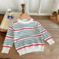 Close-up detail of infant cotton crewneck knitted sweater featuring cute red and green stripes. - 80 / Blue Red Stripes