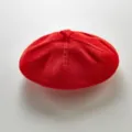 Detail view of the red knitted baby beret, showing clear texture and cute style for infants. - One Size / Red