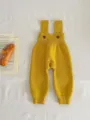 Cozy baby knit strap pants in solid yellow, featuring cute button details and ribbed cuffs. - 66cm / Bottoms / Yellow