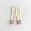 Infant baby girl knit leggings, cream and pink ribbed trousers with cute pom-poms. - 66cm / Apricot