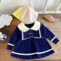 Detailed view of toddler girls navy style knit sweater dress with pleated skirt and beret. - 73cm / Sapphire Blue