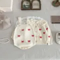 Baby knit cardigan and romper set detailed flat lay showing cute red bow embroidery. - 66cm / Set