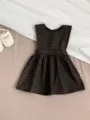 Detail view of baby toddler dark plaid sleeveless dress flat lay with cute shoes display. - Coffee Plaid Dress / 73cm