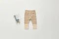 Detailed view of cute baby striped cotton leggings with ribbed cuffs in brown and white color. - 80cm / Khaki & Off-white Stripes