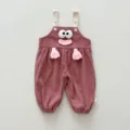 Detail view of cute baby corduroy overalls featuring 3d cartoon eyes and hands design. - 66cm / Pink