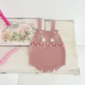 Infant pink knit romper detailed with floral embroidery and bobble details for cute baby style. - 100 / Tops