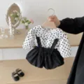 Detailed view of baby girl autumn outfit set featuring heart print blouse and black shorts. - 66cm / Top And Bottom / Black and White