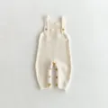 Knitted baby romper with wooden buttons, cute infant overalls for everyday casual wear. - 66cm / Jumpsuits / Light Beige