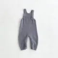 Knit baby romper detail shot, grey color, comfortable suspender design with buttons. - 66cm / Jumpsuits / Gray