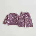 Girls knitwear detail showing jacquard bow pattern on purple sweater and pants set texture. - 73cm / Set / Purple
