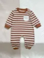 Detailed view of baby striped long sleeve romper with chest pocket and snap closure. - 66cm / Coffee Stripe