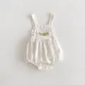 Detailed view of baby knit romper featuring delicate floral embroidery and sweet ruffled straps. - 66cm / White Suspender Rompers
