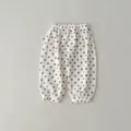 Detail shot of baby gauze anti-mosquito pants featuring soft fabric and elastic waist. - 73cm / Bottoms / Polka Dot Trousers