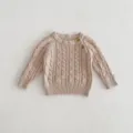 Closeup of baby cable knit sweater texture, soft cotton fabric, cute shoulder button detail. - 66cm / Tops
