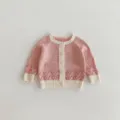 Pink knit cardigan detail, cute hollow pattern, white ribbed trim, single breasted buttons. - 66cm / Multi-pink