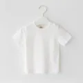 Detailed view of simple solid white baby short sleeve t-shirt, soft and breathable. - 80cm / White