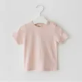Infant baby solid pink short sleeve t-shirt detail showing round neck and shoulder button. - 80cm / Pink