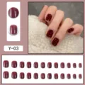 Detailed view of dark red press-on nails with silver glitter edge, showcasing full set and hand wear. - Burgundy Cat Eye Short Square (Y-03) / Glue Type