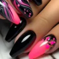 Close-up of long teardrop press-on nails featuring striking black pink marble art and 3D drops. - Glue Style (Y-568)