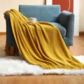 Cozy yellow knitted throw blanket with tassel fringe, perfect sofa blanket and office nap shawl. - Pineapple Warp Knitted - Ginger