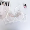 Sexy white lace bra with delicate floral embroidery, thin supportive cups, and elegant straps. - 70B / Tops / White