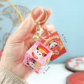 Süßer chinesischer Neujahr Panda Puzzle-Box und roter Umschlag Schlüsselanhänger! - Schlüsselanhänger mit Panda-Zauberwürfeln