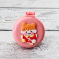 Portable foldable air cushion hair brush with cute cartoon girl design for daily hair care. - Pink Background Girl
