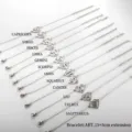 Silver stainless steel zodiac sign charm bracelet with heart cutout constellation pendants. - Steel Color Bracelet (Taurus)