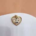 Gold-plated heart soccer pendant with cubic zirconia inlay and inspirational text detail. - Heart Hollow Soccer (She Believed)