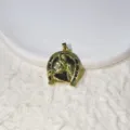 Detailed close-up of a brass micro-inlaid zircon horseshoe horse head pendant accessory. - Horse Head Horseshoe Shape