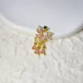 Detailed shot of gold-plated micro-paved zirconia butterfly tassel pendant for DIY jewelry. - 18K Gold Plated Pink And White Zirconia Style / Gold