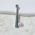Close-up detail of the silver-tone baseball bat and pink baseball pendant charm for DIY jewelry. - Silver and Pink Ball Style