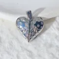 Close-up view of silver heart pendant with sparkling zircons and heartbeat line detail. - Silver Openable Pulse Heart (F2034-3.5)