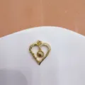 Gold-plated heart volleyball pendant detail, micro-inlaid zircon, exquisite jewelry accessory. - Heart Hollow Volleyball