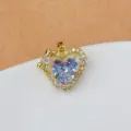 Ciondolo cuore dorato con zircone scintillante e grazioso fiocco, accessorio di gioielleria. - Cuore Iridato Oro