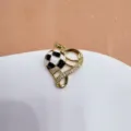 Gold heart hollow football pendant with black white oil drop and cubic zirconia bling. - Heart Hollow Soccer (Color Preserving)