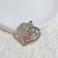 Detailed view of the elegant silver-tone MOM heart pendant necklace with clear sparkling crystals. - Silver Hollow Heart Inlaid Pink Rhinestone Style