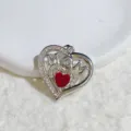 Close-up detail shot of a silver heart pendant featuring MOM lettering and a red crystal center. - Silver Hollow Heart Inlaid Red Rhinestone Style