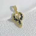 Gold plated phoenix angel wing pendant detail with black enamel and sparkling cubic zirconia. - Black Enamel Angel Wings (1) / Gold