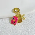 Gold-plated travel charm pendant with pink suitcase and airplane for DIY bracelets. - Gold